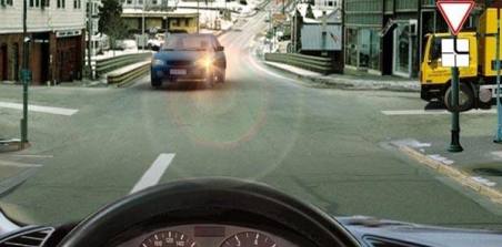Which vehicle you must give way to as you continue straight ahead?