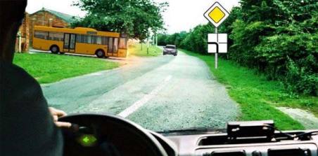 Which vehicle must you give way to if you intend to make a left turn at an intersection?