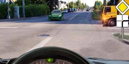 What vehicle must you give way to if you intend to make a U-turn at an intersection?
