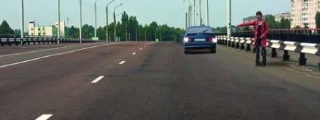 Is the passenger car driver allowed to approach the passenger on the bridge while reversing?