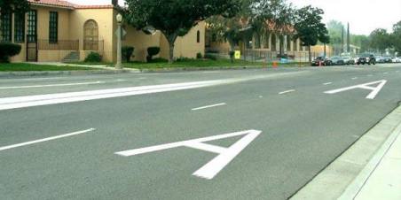 For which vehicles is the lane marked with the letter "A"?
