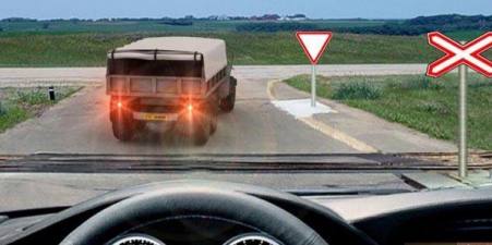 Is it allowed to pass a railroad crossing in this situation?